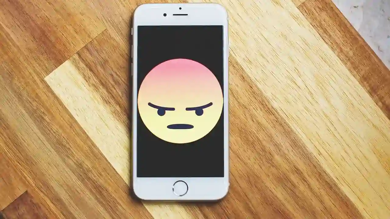 Phone with frown emogee